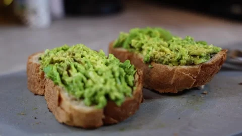 Two bread sandwiches and an avacado Video stock 308295652