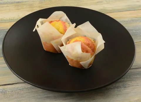 Two breakfast lemon strawberry mini muffins Stock Photos