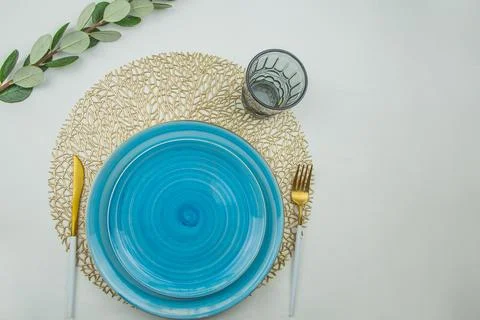 Two bright blue serving plates with a spiral pattern of different sizes, stand Stock Photos