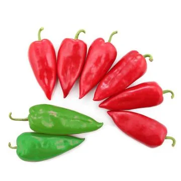 Two bright green and six red sweet peppers on a white background Stock Photos