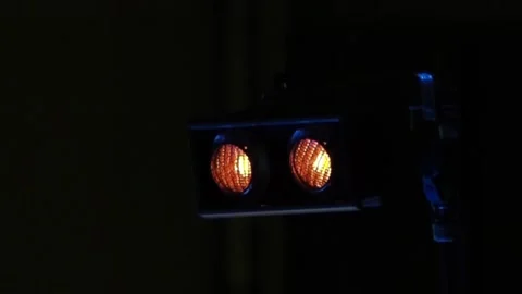 Two bright spotlights flash on stage, then flash brightly, in a loop 스톡 동영상 155211131