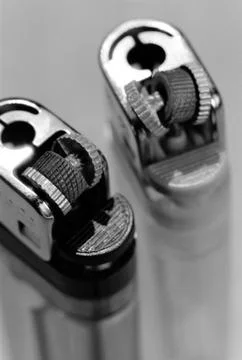 Two broken lighters Stock Photos
