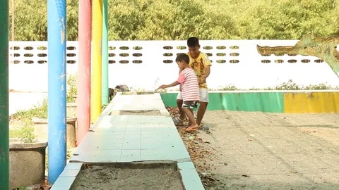 Two brother playing at playground Stock Footage 73708448