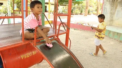 Two brother playing at playground Stock Footage 73710783