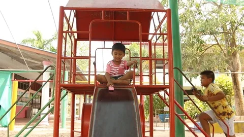 Two brother playing at playground Stock Footage 73710805