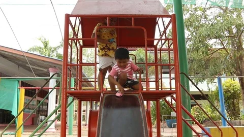 Two brother playing at playground Stock Footage 73711416