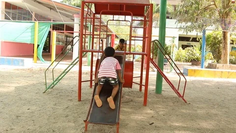 Two brother playing at playground Stock Footage 73715210
