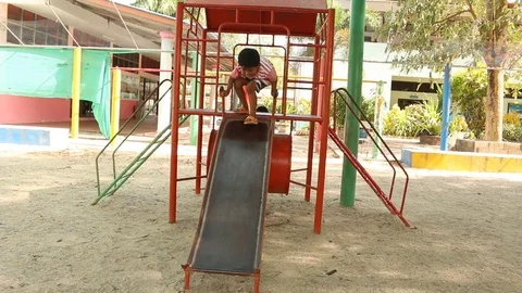 Two brother playing at playground Stock Footage 73715621