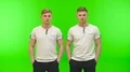 The two brothers stand on the green background 4k or 4k+ Resolution