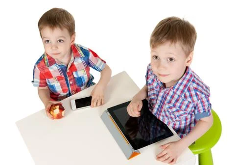 Two brothers with a tablet pc Stock Photos