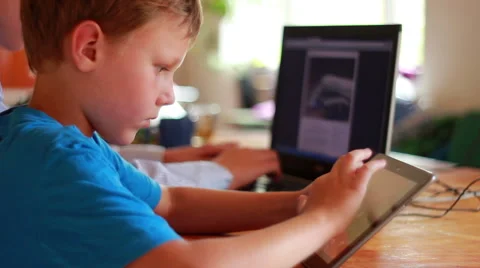 Two Brothers Using Laptop And Ipod Stock-Footage 40746169