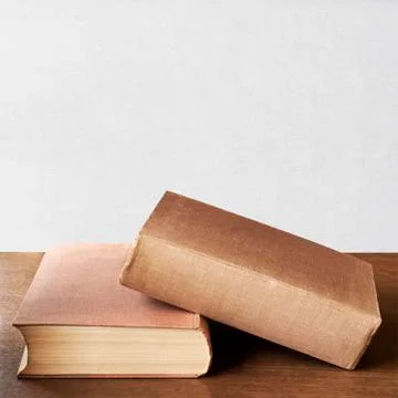 Two brown books on the table Stock Photos