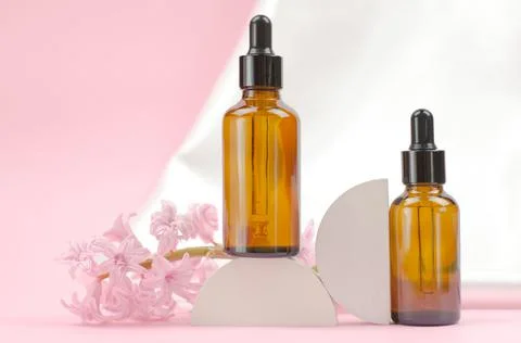 Two brown bottles with a dropper with essential oils or serum Stock Photos