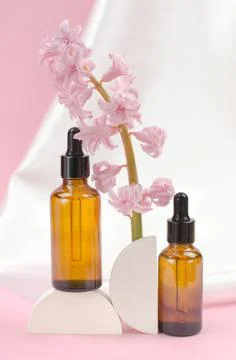 Two brown bottles with a dropper with essential oils or serum Stock Photos
