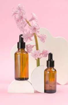 Two brown bottles with a dropper with essential oils or serum Stock Photos