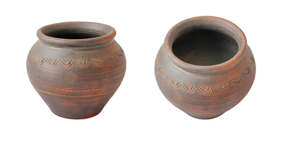 Two brown ceramic pots from different angles. Vessels made of baked clay. Stock Photos