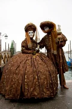Two brown costumes and masks, carnevale di venezia, carnival in venice, italy Stock Photos