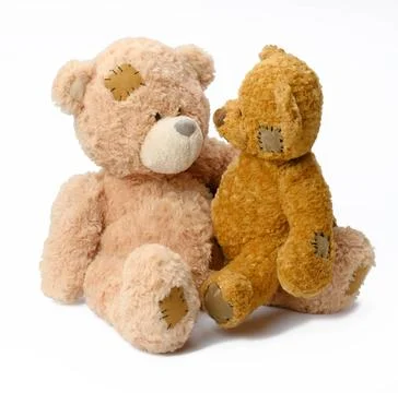 Two brown cute teddy bears on a white background two brown cute teddy bear... Stock Photos