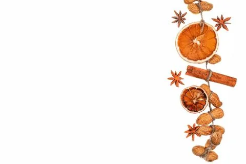 Two brown dryed orange small slice and cinnamon isolated on a white Foto stock