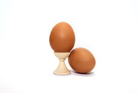 Two brown eggs isolated on the white background. Stock Photos