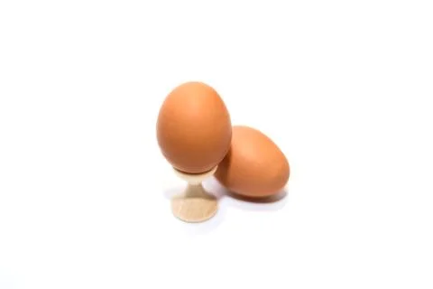 Two brown eggs isolated on the white background. Stock Photos