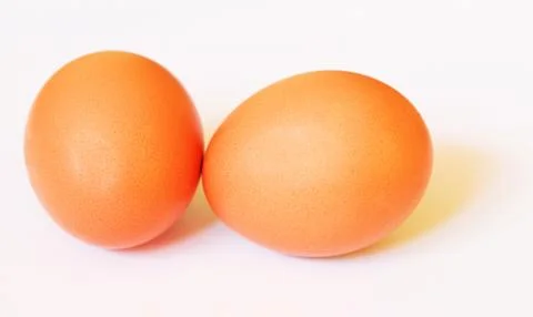 Two brown eggs with soft shadows Stock Photos