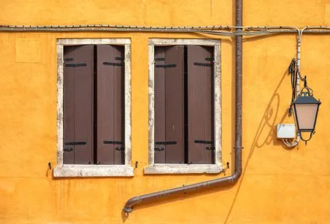 Two brown Windows of Venice Stock Photos