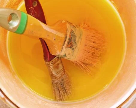 Two brushes with paint Stock Photos