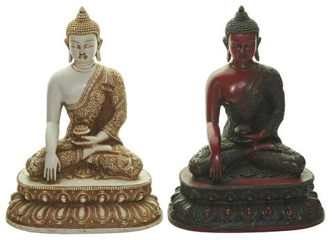 Two buddha statues meditating, symbolizing spirituality and peace Stock Photos
