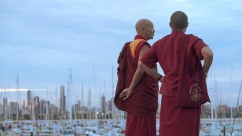 Two Buddhist monks  watching a city landscape in Melbourne Video stock 73845135