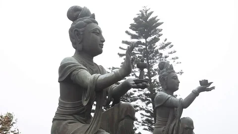 Two Buddhist Offering Statues in exteme Fog Stock Footage 104418458