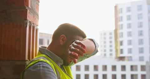 Two builders on built house background made the agreement, shaking hands. Two Stock Footage 172286220