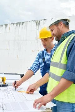 Two Builders Looking at Floor Plans 写真素材