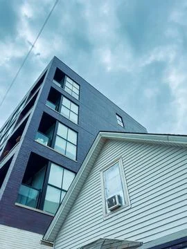 Two buildings are visible in the frame. One is modern with large windows and  Stock Photos