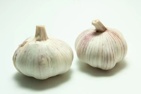 Two bulbs of garlic Stock Photos