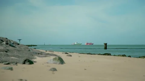 Two bulk carriers enter Port of Rotterdam [wide] Stock Footage 131648854
