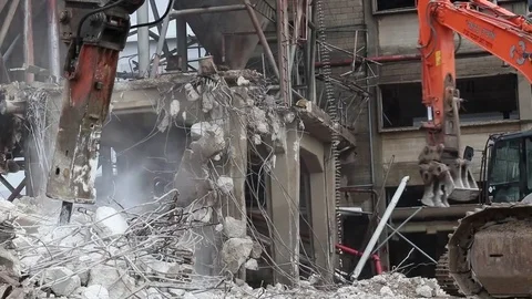 Two bulldozers clearing rubble of destroyed buildings Stock-Footage 72778762