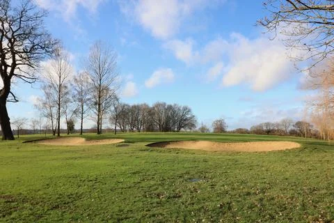 Two bunkers with trees in background during winter in the UK Stock Photos