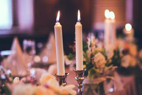 Two burning candles on the tabe 写真素材