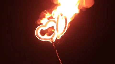 Two burning hearts fireshow. fire show. two hearts burn with fire. the metal is Stock Footage 151606160