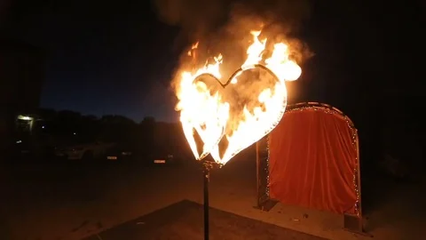 Two burning hearts on wedding fireshow. Stock Footage 80337566