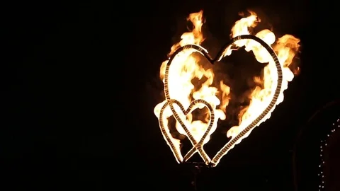Two burning hearts on wedding fireshow. Stock Footage 80337704