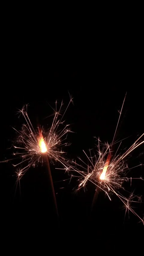 Two burning sparkler isolated on black background banner Stock Footage 283628030