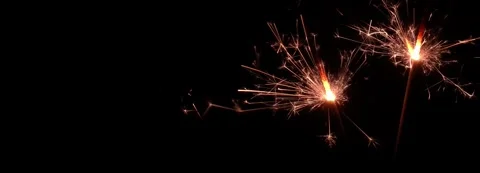 Two burning sparkler isolated on black background banner 動画素材 283628034