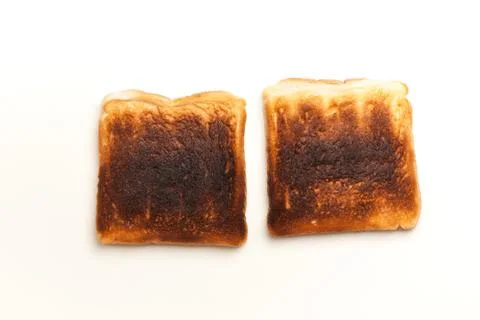 Two burnt slices of toasted bread Stock Photos
