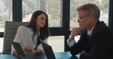 Two business colleagues discuss a project ideas using a tablet. Stock Footage 139919340