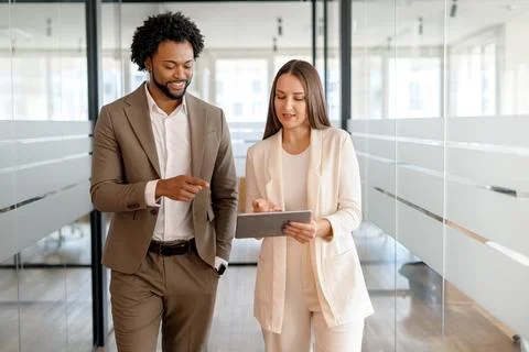 Two business colleagues engaging in a constructive discussion Stock Photos