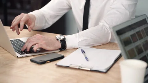 Two business colleagues talking cooperating at laptop close up. hands of Video stock 133219459