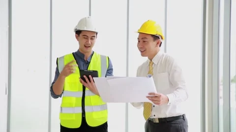 Two business construction site engineer. Engineering objects on workplace wit Video stock 162376153