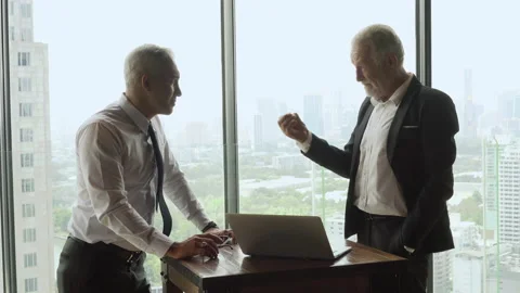 Two business man shaking hands each other over window on cityscape background Stock Footage 158471650